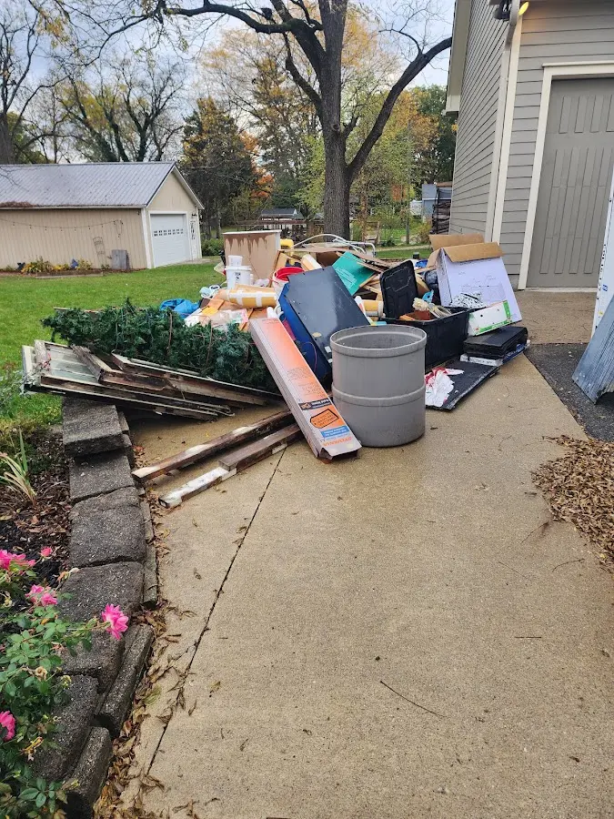 Dumpster being loaded with debris for Residential Dumpster Rental in Glassport